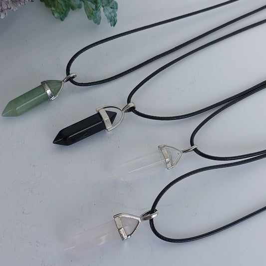 Double Terminated Point Crystal Pendants